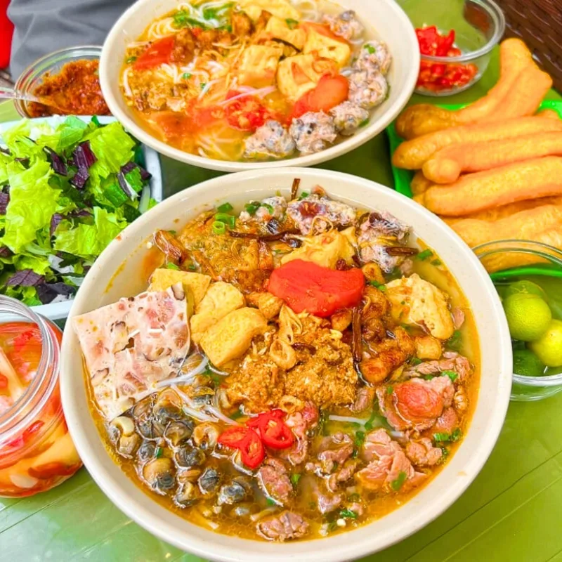 Bun Riêu Hanoi is a traditional crab-based soup with a distinctly tart broth, offering an authentic flavour